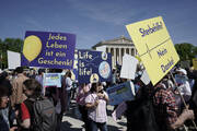Participants in the “March for Life” rally stand with banners reading “Every life is a gift,” “Life is life” and “Euthanasia no thanks” in Munich, Germany, on April 13, 2024. An independent experts commission has recommended that abortion in Germany should be made legal during the first 12 weeks of pregnancy. (Uwe Lein/dpa via AP)
