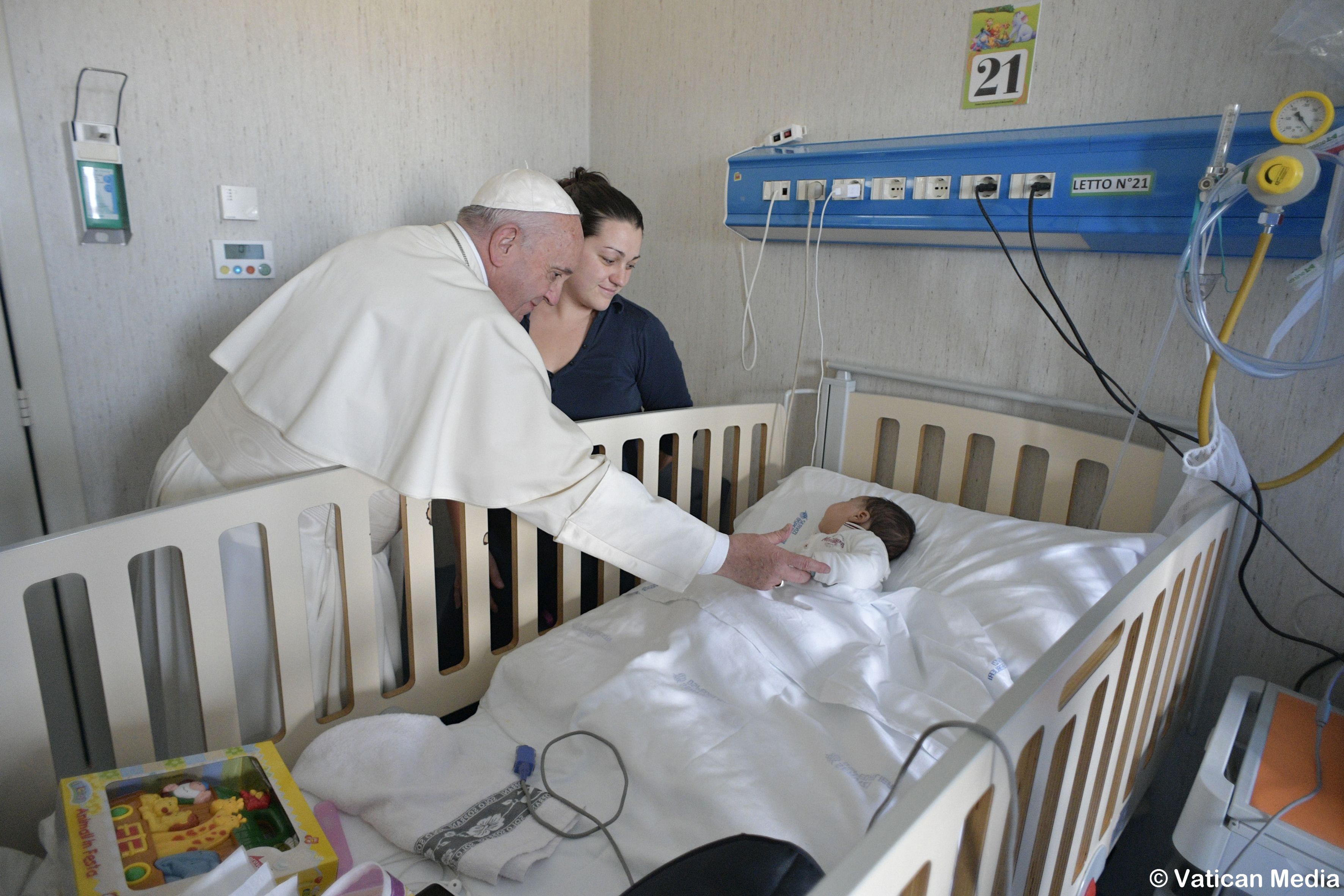 Pope Francis greets a patient during an unannounced visit Jan. 5 to children at the Palidoro Bambino Gesu Hospital, in Fiumicino, outside Rome. (CNS photo/L'Osservatore Romano)