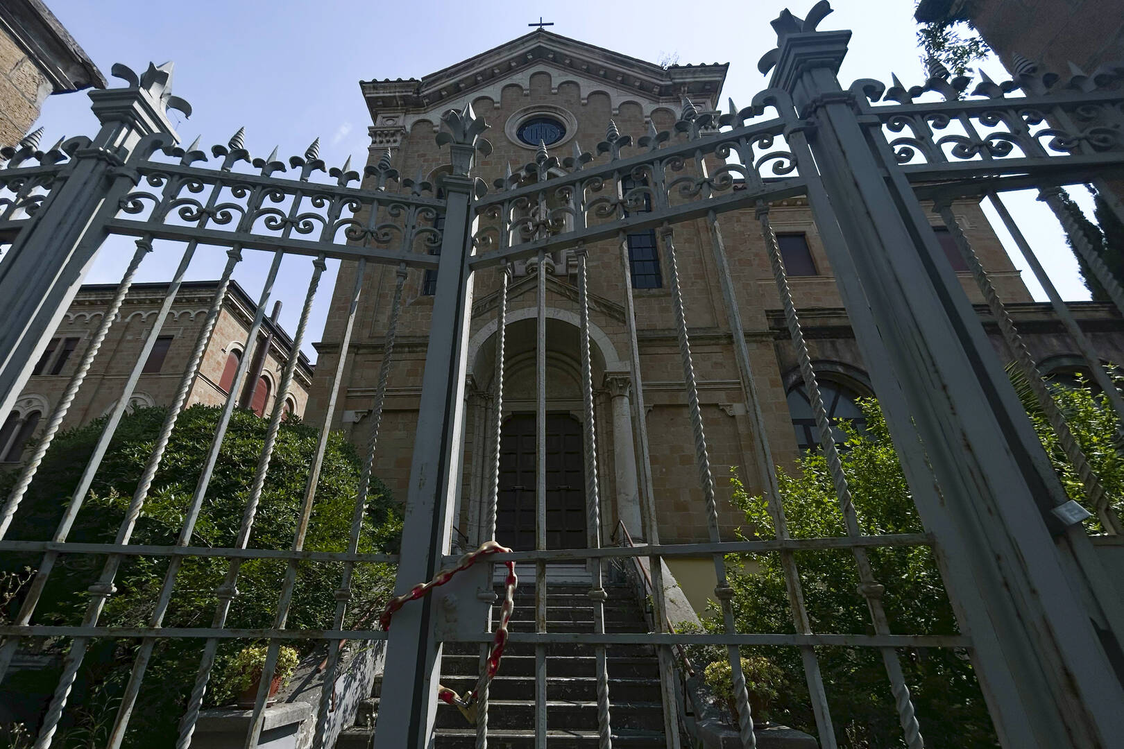 view of a monastery in rome with a fence in front of it