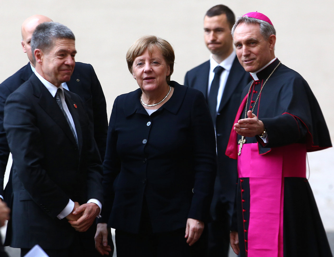 Archbishop Georg Ganswein greets German Chancellor Angela Merkel and her husband, Joachim Sauer, as they arrive March 24 for the European Union summit with Pope Francis at the Vatican (CNS photo/Alessandro Bianchi, Reuters). 