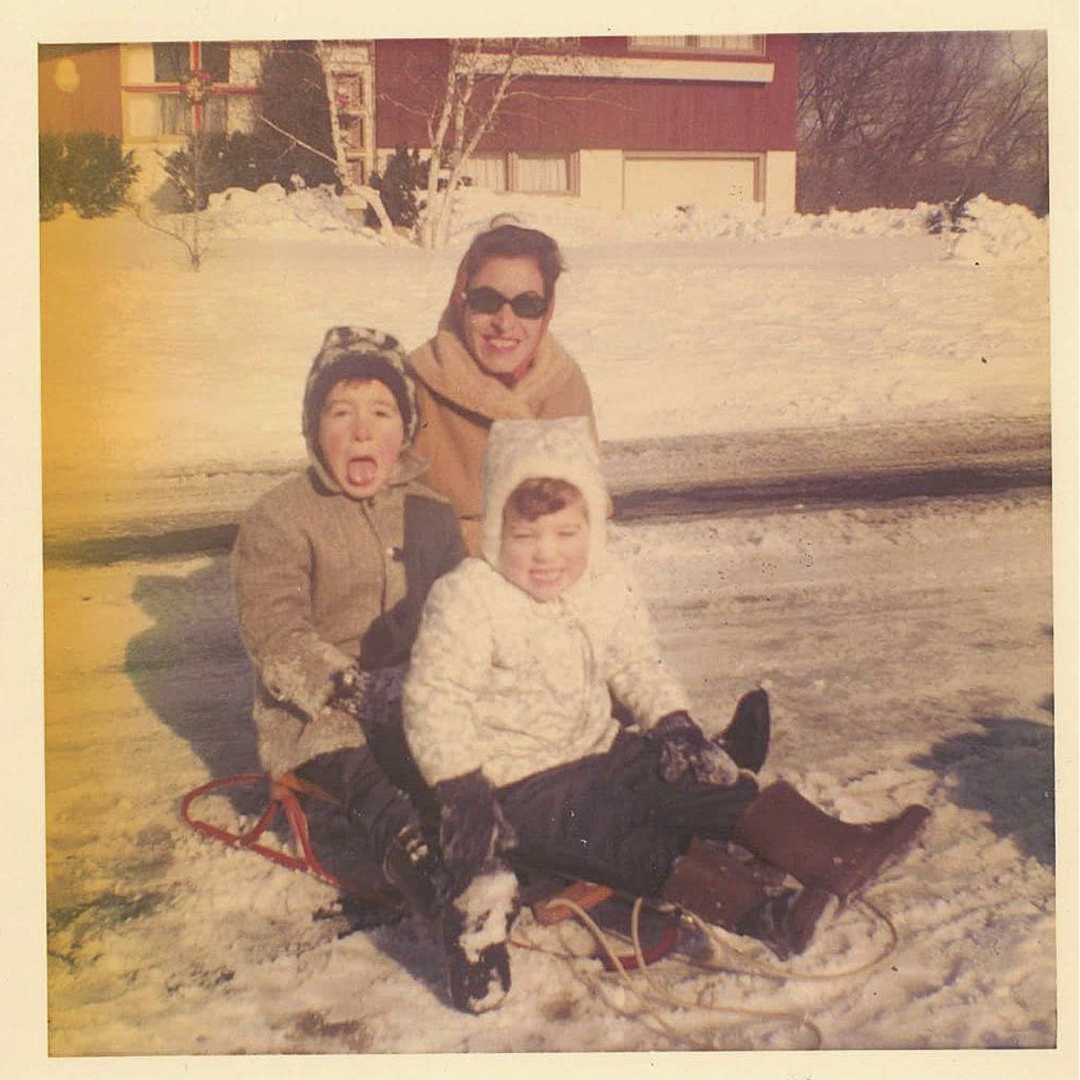 Author during his childhood, playing in the snow with his mother and sister