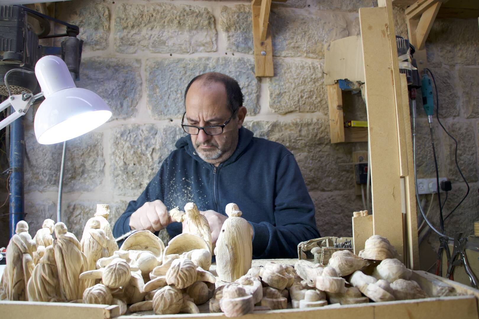 Jack Giacoman carves wood at his workshop on Milk Grotto Street (Photo by author)