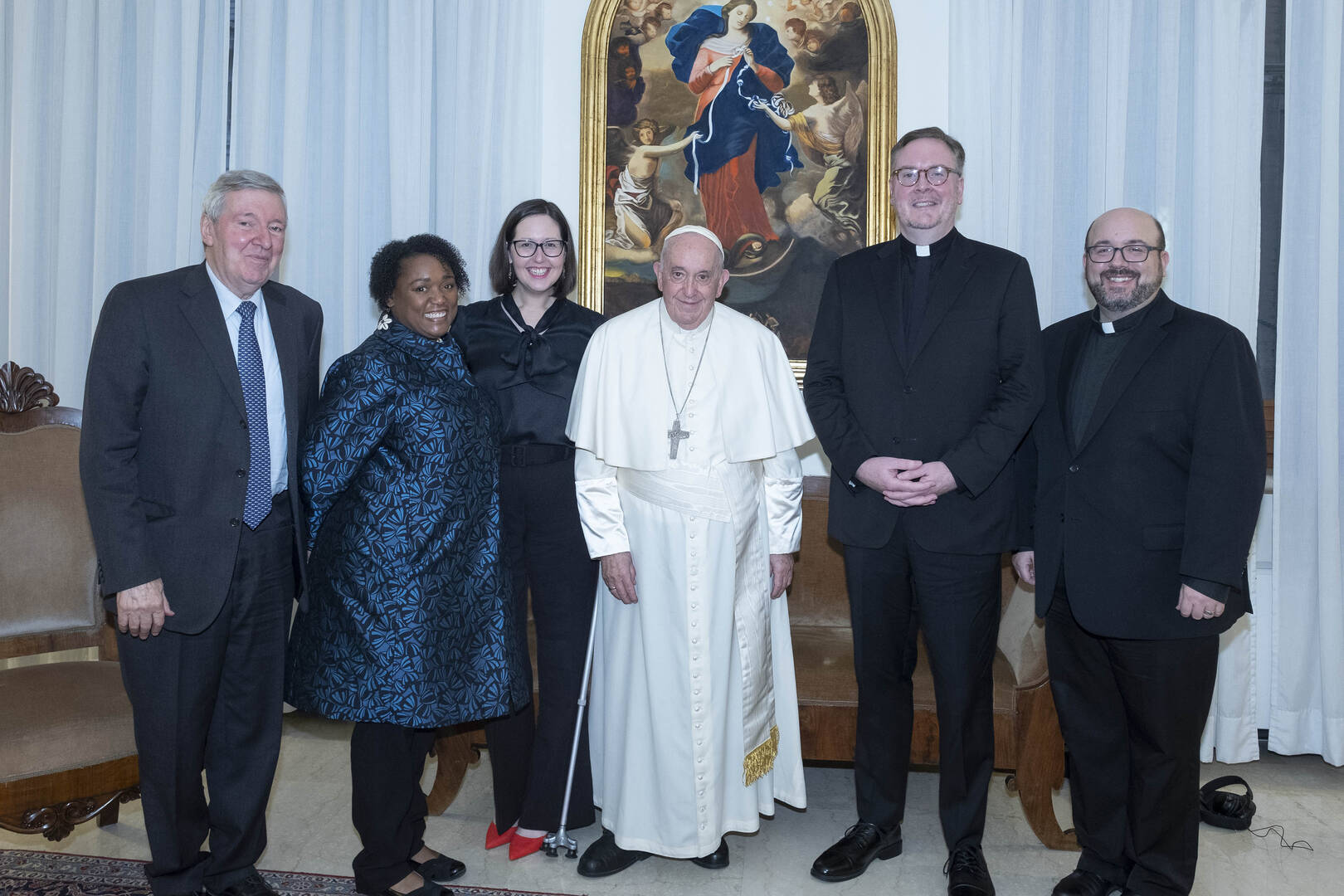 Pope Francis stands for a group photo with representatives of America.