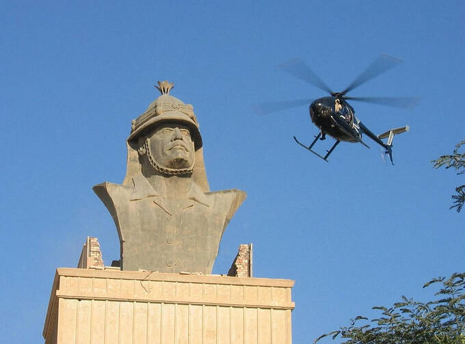 Blackwater Little Bird over Republican Palace, Baghdad (Photo via Wikimedia Commons)