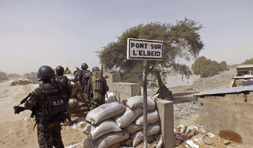 n this Wednesday, Feb. 25, 2015, file photo, Cameroon soldiers stand guard at a lookout post as they take part in operations against the Islamic extremists group Boko Haram, their guard post is on Elbeid bridge, left rear, that separates northern Cameroon form Nigeria's Borno state near the village of Fotokol, Cameroon. Nigerian Air Force fighter jet on a mission against Boko Haram extremists mistakenly bombed a refugee camp Tuesday, Jan. 27, 2017, killing more than 100 refugees and wounding aid workers, a 