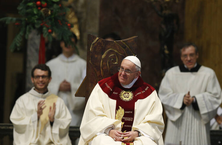 Pope Francis smiles during Mass at the Church of the Gesu in Rome Jan. 3. The Mass was celebrated on the feast of the Most Holy Name of Jesus in thanksgiving for the recent canonization of Jesuit St. Peter Faber. (CNS photo/Paul Haring) (Jan. 3, 2014) 