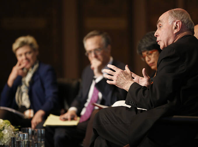 Father Hehir gestures during 'Faith, Culture and the Common Good' conference at Georgetown.