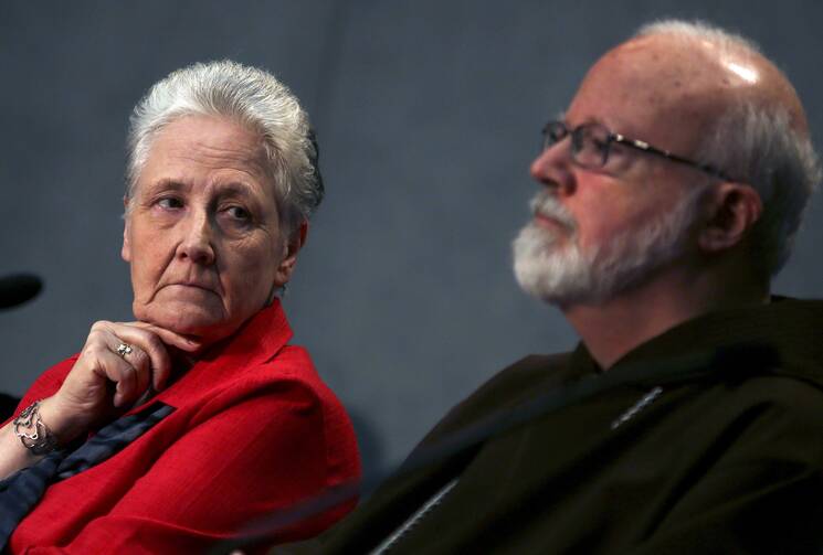 Irish abuse victim Marie Collins, the lone clerical abuse survivor nominated by Pope Francis to sit on the new Pontifical Commission for the Protection of Minors, looks at Boston Cardinal Sean P. O'Malley during their first briefing at the Holy See press office at the Vatican on May 3. (CNS photo/Alessandro Bianchi, Reuters)