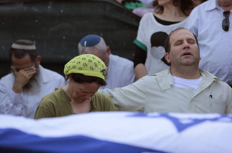 The parents of Naftali Frankel attend his funeral service in Nof Ayalon, Israel, July 1. (CNS photo/Jim Hollander, EPA) 