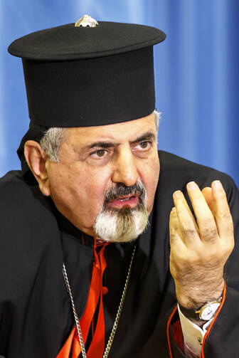 Syriac Catholic Patriarch Ignace Joseph III Younan gestures during a press conference on the human rights situation of Christians in Iraq and Syria at the European headquarters of the United Nations in Geneva Sept. 16. (CNS photo/Salvatore di Nolfi, EPA)