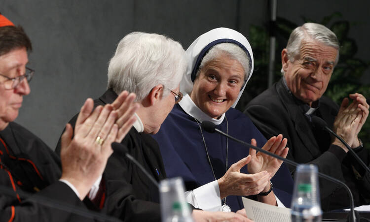 Sister Sharon Holland, president of the Leadership Conference of Women Religious, receives applause at Vatican press conference for release of final report of Vatican-ordered investigation of U.S. communities of women religious.