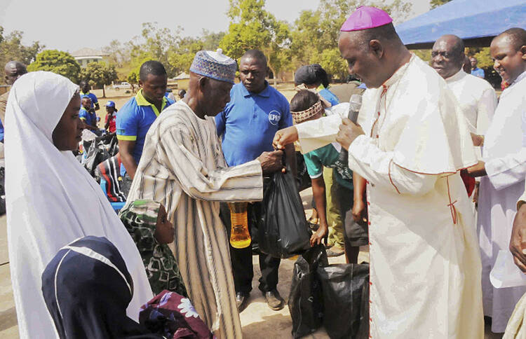 Nigerian archbishop presents relief material to internally displaced people in Jos, Nigeria