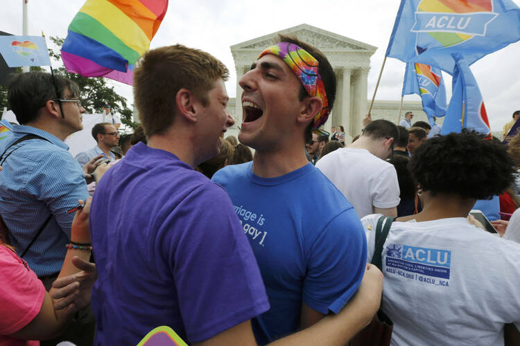 Supporters of marraige rights for same-sex couples celebrate outside the U.S. Supreme Court on June 26. (CNS photo/Jim Bourg, Reuters) 
