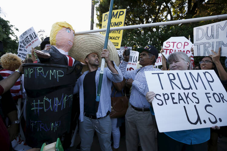Supporters and opponents of Donald Trump taunt each other in Los Angeles in July. (CNS photo/Lucy Nicholson, Reuters)