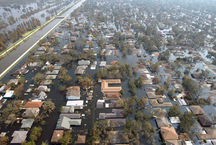 Houses in New Orleans are seen under water Sept. 5, 2005, after Hurricane Katrina swept through Louisiana, Mississippi and Alabama. More than a decade after the storm, New Orleans continues to rebuild. (CNS photo/Allen Fredrickson, Reuters)