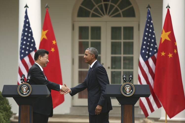 U.S. President Barack Obama and Chinese President Xi Jinping shake hands following a joint news conference in the Rose Garden at the White House Sept. 25 in Washington. (CNS photo/Gary Cameron, Reuters)