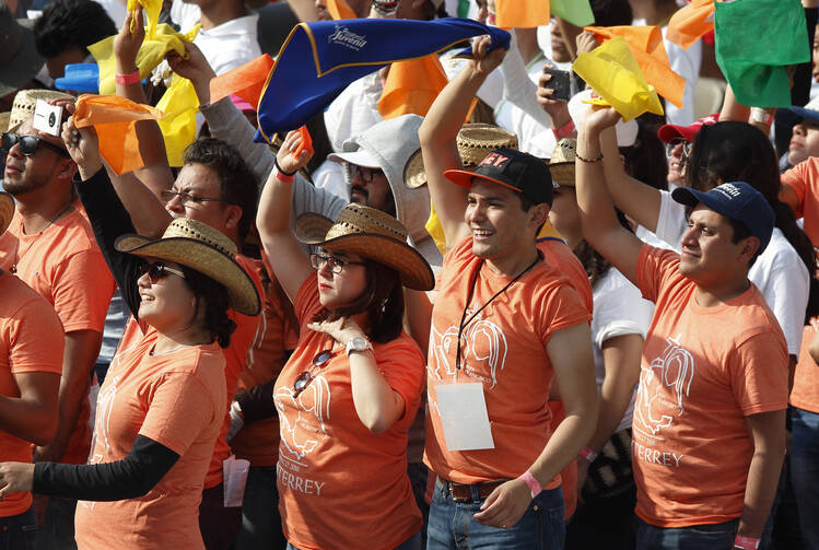Young people cheer as Pope Francis leads a meets with them at the Jose Maria Morelos Pavon Stadium in Morelia, Mexico, Feb. 16. (CNS photo/Paul Haring) 