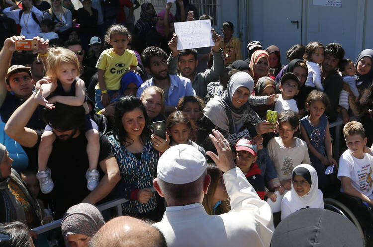 Pope Francis greets refugees at the Moria refugee camp on the island of Lesbos, Greece, April 16, 2016. (CNS photo/Paul Haring)