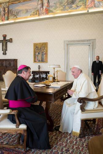 Pope Francis talks with Archbishop Christophe Pierre, the new apostolic nuncio to the United States, during an April 21 meeting at the Vatican. (CNS photo/L'Osservatore Romano)