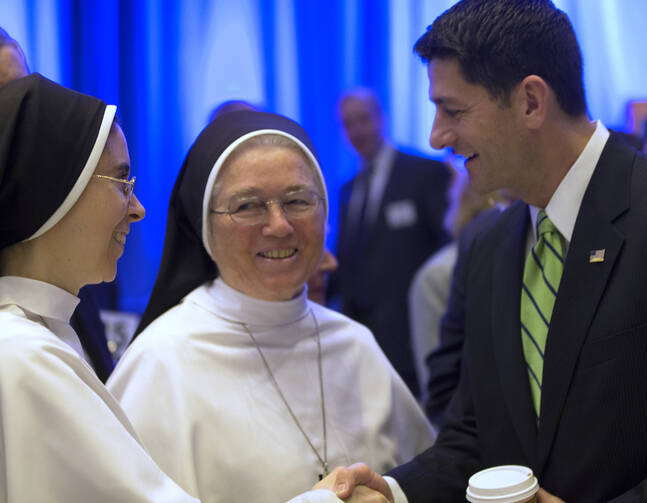 U.S. House Speaker Paul Ryan, R-Wis., greets women religious at the National Catholic Prayer Breakfast May 17 in Washington. (CNS photo/Bob Roller)