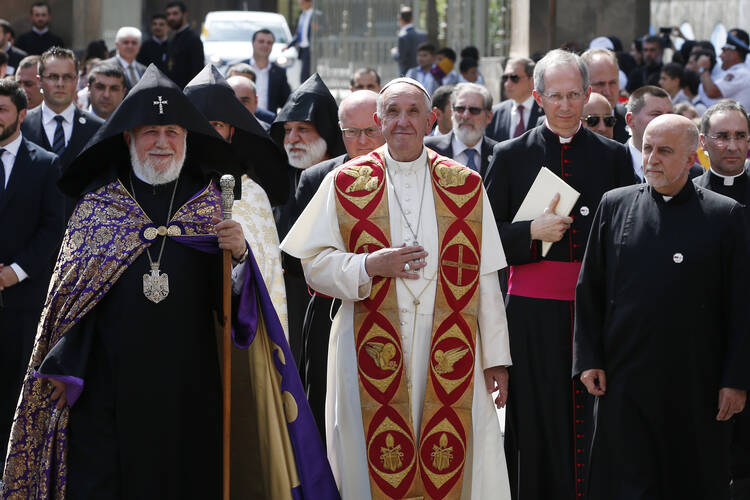 Catholicos Karekin II, patriarch of the Armenian Apostolic Church, and Pope Francis arrive to visit the Armenian Apostolic Cathedral at Etchmiadzin in Vagharshapat, Armenia, June 24. (CNS photo/Paul Haring)