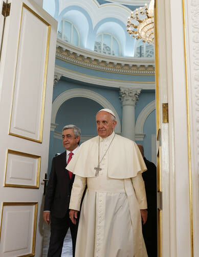 Pope Francis and Armenian President Serzh Sargsyan arrive for a courtesy visit in the presidential palace in Yerevan, Armenia, June 24. (CNS photo/Paul Haring)