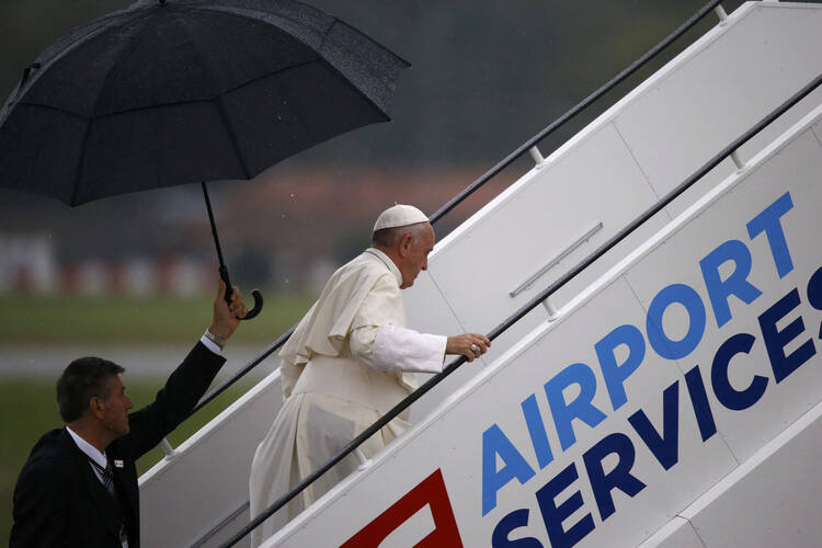 Pope Francis enters a plane following the July 31 World Youth Day farewell ceremony at John Paul II International Airport in Krakow, Poland. (CNS photo/Kacper Pempel, Reuters)