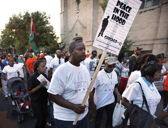 Participants walk during a call for an end to violence in their community June 17 in Chicago. The march followed a rally in front of St. Sabina Church. (CNS photo/Karen Callaway)