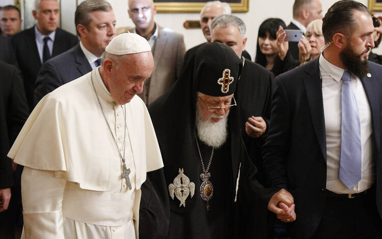 Pope Francis and Orthodox Patriarch Ilia II of Georgia arrive for a meeting at the patriarchal palace in Tbilisi, Georgia, Sept. 30. (CNS photo/Paul Haring)