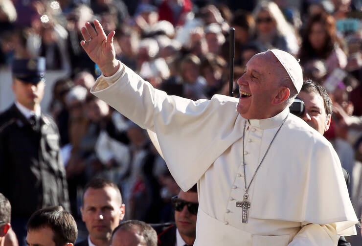 Pope Francis waves as he arrives to lead his Nov. 9 general audience in St. Peter's Square at the Vatican. (CNS photo/Stefano Rellandini, Reuters)