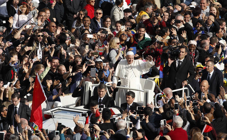 Pope Francis greets the crowd after celebrating the closing Mass of the jubilee Year of Mercy in St. Peter's Square at the Vatican Nov. 20. (CNS photo/Paul Haring)