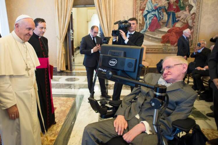 Pope Francis greets British theoretical physicist and cosmologist Stephen Hawking, during an audience with participants attending a plenary session of the Pontifical Academy of Sciences at the Vatican on Nov. 28. (CNS photo/L'Osservatore Romano, handout)