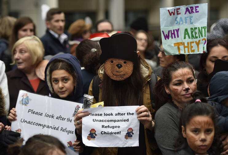 Demonstrators gather during a children's refugee protest in 2016 in London. (CNS photo/Hannah McKay, EPA