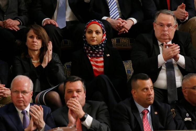 A Muslim woman adorned in an American flag listens as President Donald Trump delivers his first address to a joint session of Congress on Feb. 28 in Washington. (CNS photo/Jonathan Ernst, Reuters)