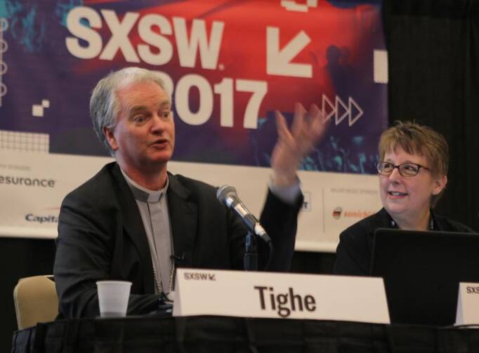 Irish Bishop Paul Tighe, adjunct secretary of the Pontifical Council for Culture, speaks on March 10 during the South by Southwest Festival in Austin, Texas. At right is Helen Osman, a communication adviser. (CNS photo/Matt Palmer)