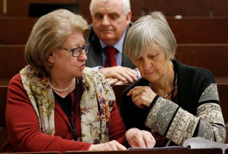 Hanna Suchocka and Dr. Catherine Bonnet, both members of the Pontifical Commission for the Protection of Minors, talk during a seminar on safeguarding children at the Pontifical Gregorian University in Rome on March 23. (CNS photo/Paul Haring)