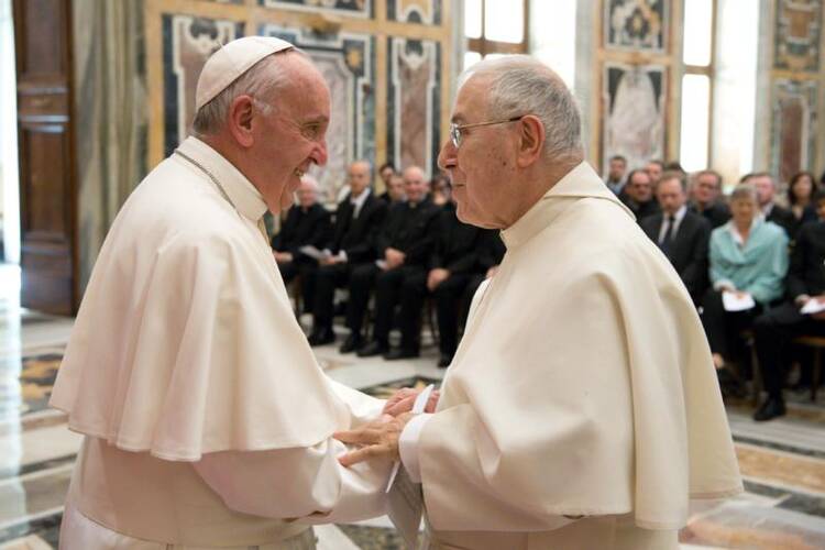 Pope Francis greets Norbertine Father Bernard Ardura, president of the Pontifical Committee for Historical Sciences, on March 31 at the Vatican. The pope met with scholars taking part in a Vatican-sponsored congress on the Lutheran Reformation as part of the 500th anniversary commemorating the start of Luther's call for reform. (CNS photo/L'Osservatore Romano)