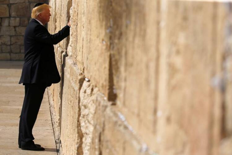U.S. President Donald Trump places a note in the Western Wall in Jerusalem on May 22. (CNS photo/Jonathan Ernst, Reuters)
