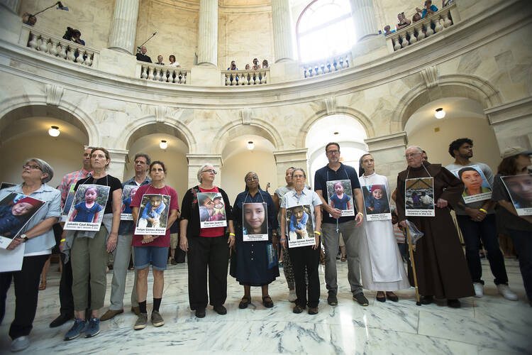 Catholic leaders and advocates protest the Trump administration’s handling of detained immigrant children during a “Day of Action” on July 18 in the Russell Senate Office Building in Washington, D.C. (CNS photo/Tyler Orsburn)