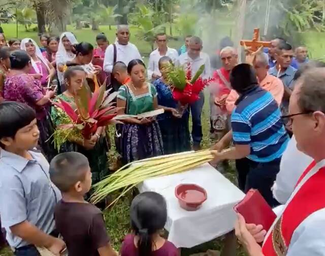 After a 12-hour journey from Belize City, Jesuit Father Sam Wilson begins Palm Sunday Mass with the people of Machakilha, deep in Mayan territory along the Belize border with Guatemala. Screen grab from video taken by Jeremy Zipple, S.J.