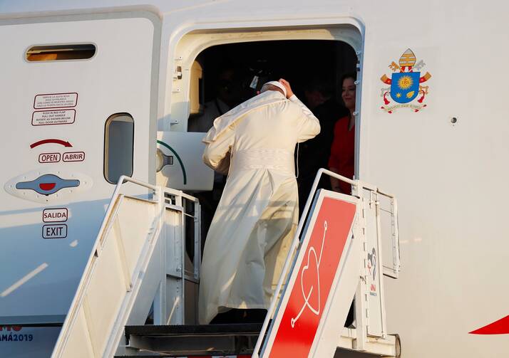 Pope Francis is pictured in a 2019 photo boarding the plane for a trip. The Vatican confirmed that Pope Francis will travel to Kazakhstan Sept. 13-15, 2022, and will attend the VII Congress of Leaders of World and Traditional Religions. (CNS photo/Henry Romero, Reuters)