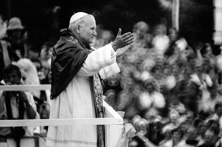 for an article about JPII knowledge of sex abuse cases, pope john paul ii waves to a crowd in a 1979 black and white photo in czenstochowa, poland, 
