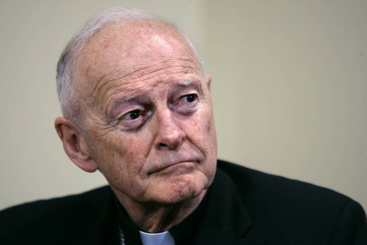 theodore mccarrick in a file photo wears his collar and looks off to the side