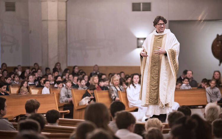  Father Whitfield preaching at a Mass in St. Rita Catholic Community, Dallas, Tex. (photo supplied)