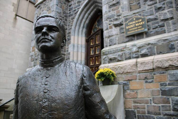 A statue of Blessed Michael McGivney in front of St. Mary's Church in New Haven, Connecticut.