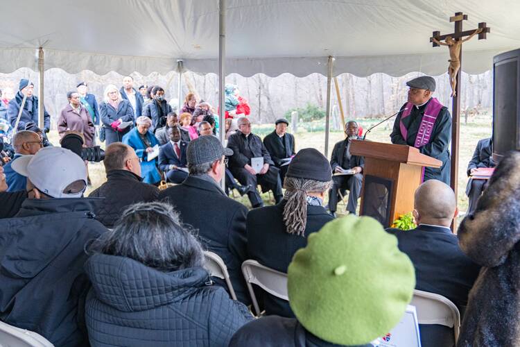 Washington Cardinal Wilton D. Gregory leads a prayer service on Feb. 25, 2023, for enslaved people believed to be buried in the cemetery at Sacred Heart Parish in Bowie, Md. The property is on a former plantation once owned by members of the Society of Jesus in Maryland in the 1700s and 1800s. (OSV News photo/Mihoko Owada, Catholic Standard)