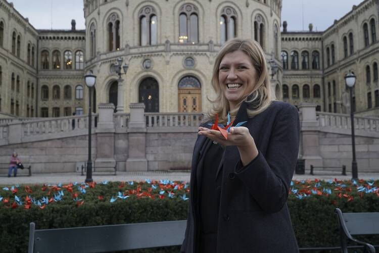 Beatrice Fihn, the executive director of the International Campaign to Abolish Nuclear Weapons (ICAN) holds two paper cranes in Oslo on Dec. 9. (AP Photo/David Keyton)