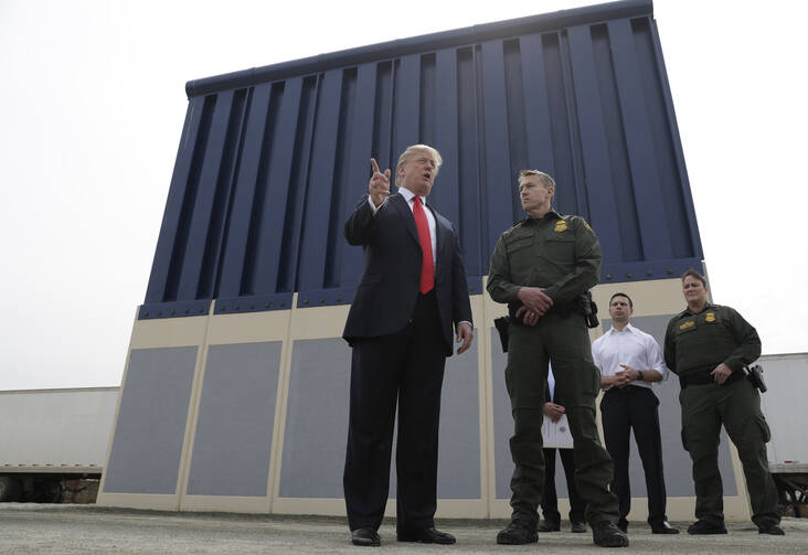 President Donald Trump reviews border wall prototypes on March 13 in San Diego. (AP Photo/Evan Vucci)