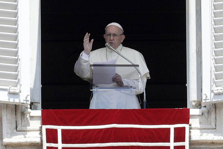 Pope Francis delivers a blessing from his studio window overlooking St. Peter's Square at the Vatican on Aug. 5. (AP Photo/Gregorio Borgia File)