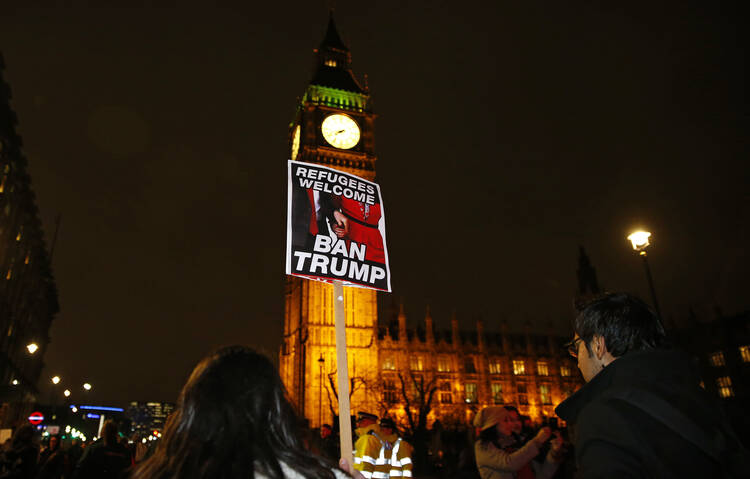 Demonstrators protest against U.S. President Donald Trump's controversial travel ban on refugees and people from seven mainly-Muslim countries, in London on Jan. 30. (AP Photo/Alastair Grant)